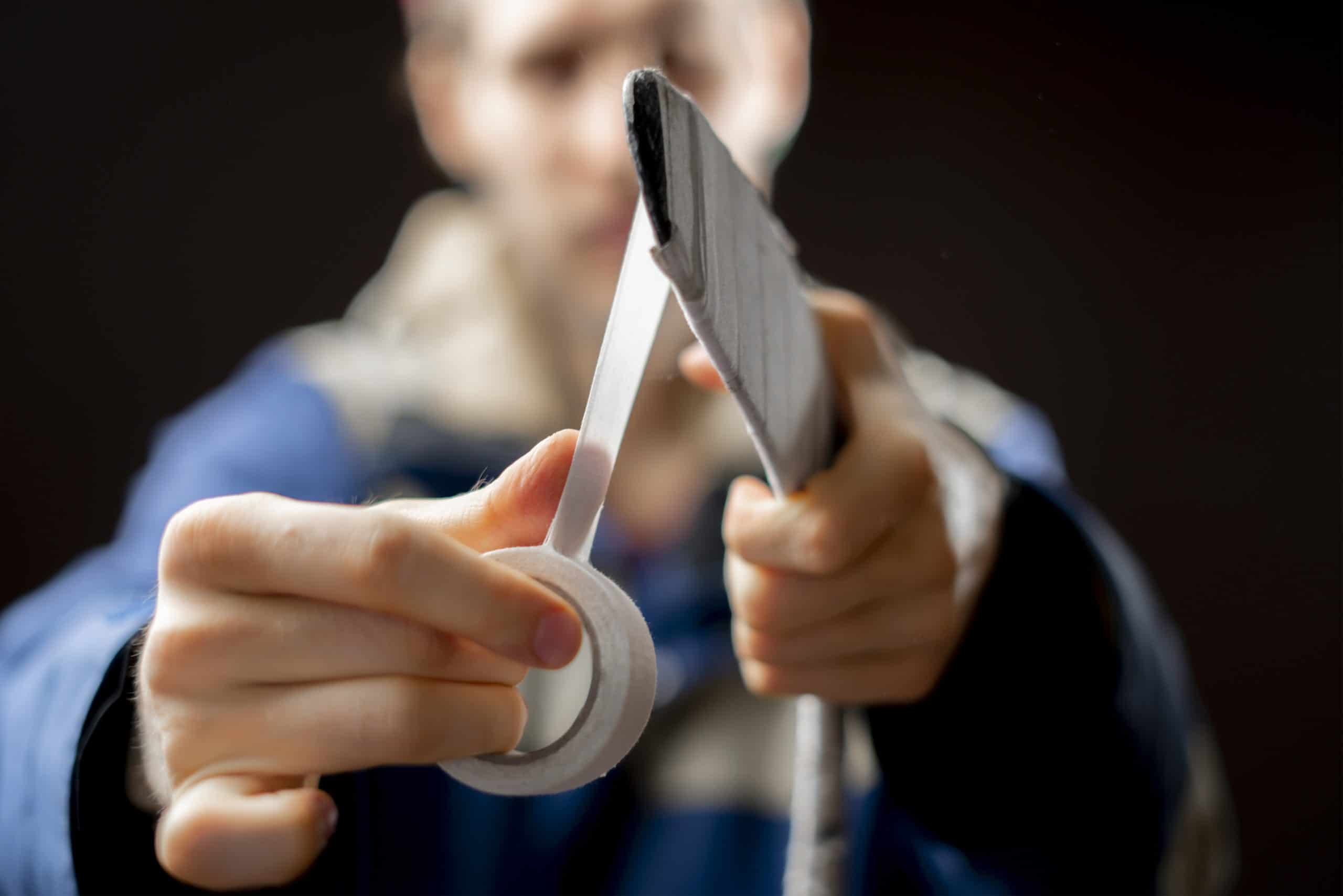 Why Do You Tape a Hockey Stick: Enhance Grip and Performance